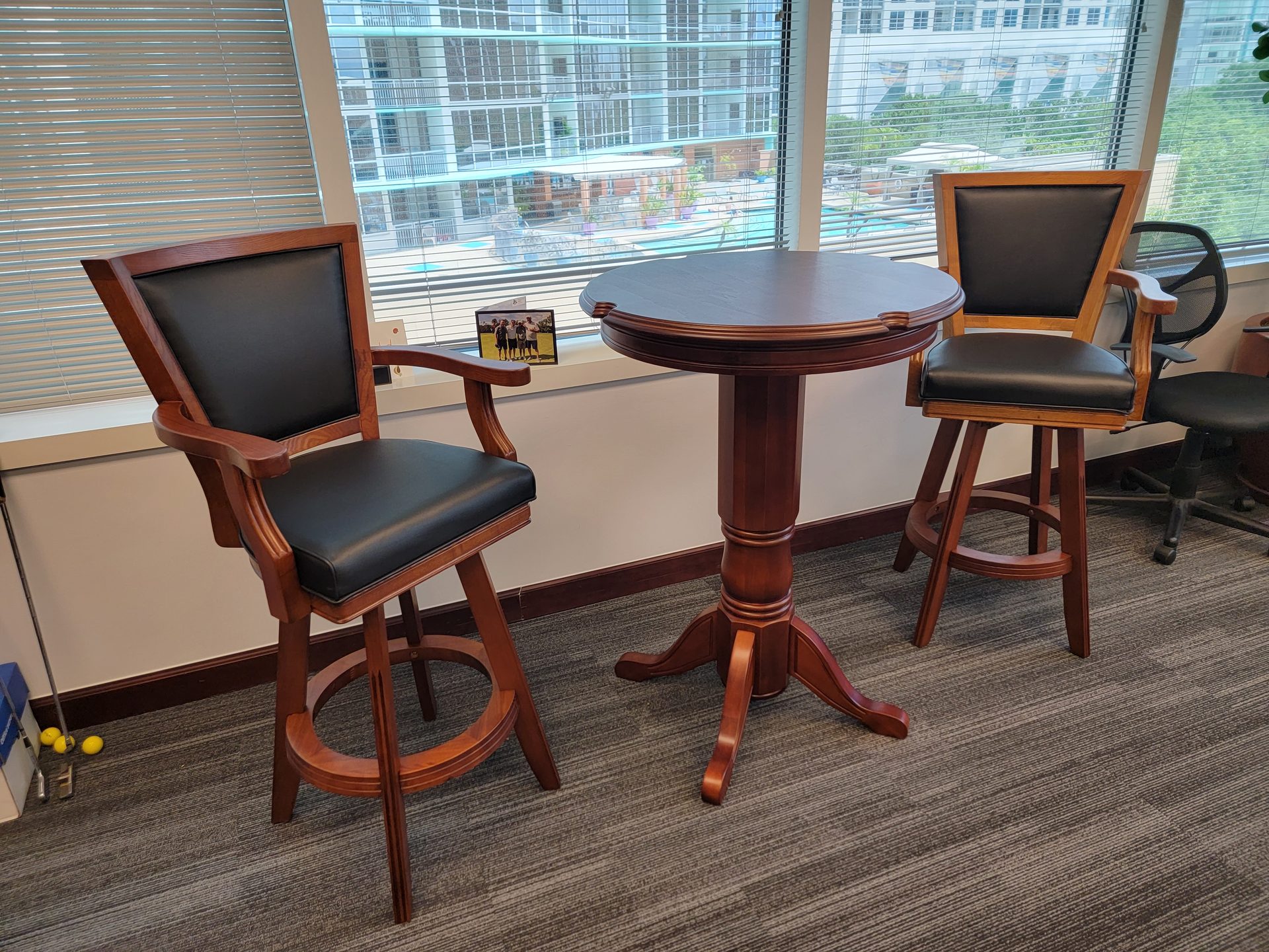 Cherry wood pub table with leather swivel bar stools assembled by DR Assembly