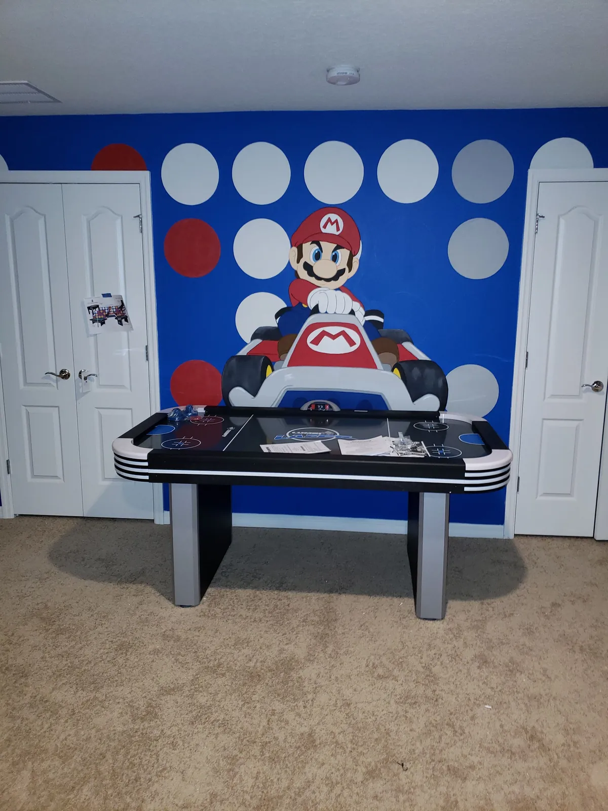 Air hockey table assembled in a Mario themed kids game room in Florida