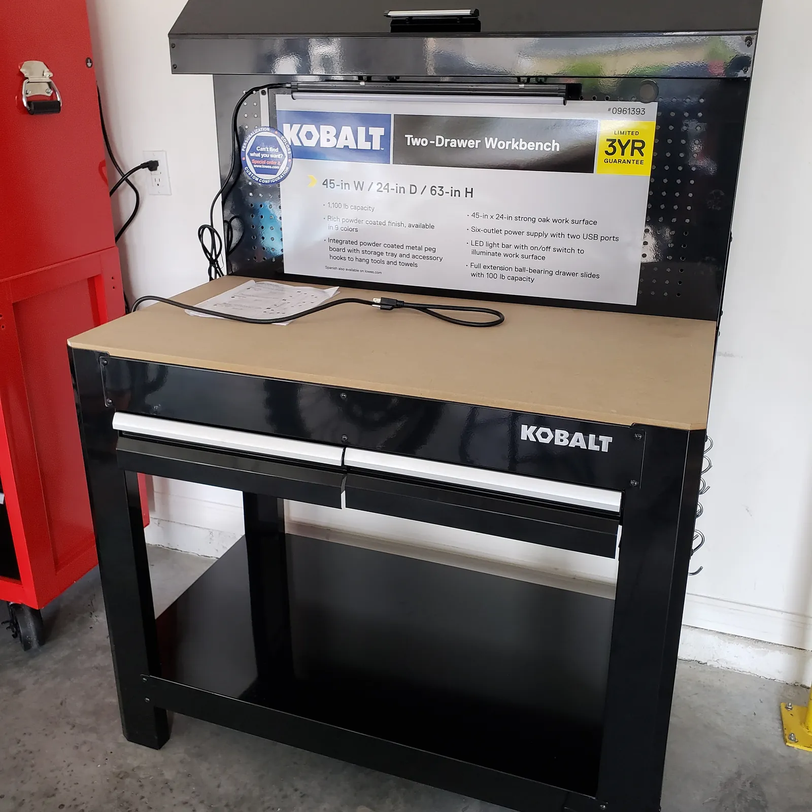 Kobalt two drawer workbench with pegboard and LED light bar assembled in a Florida garage