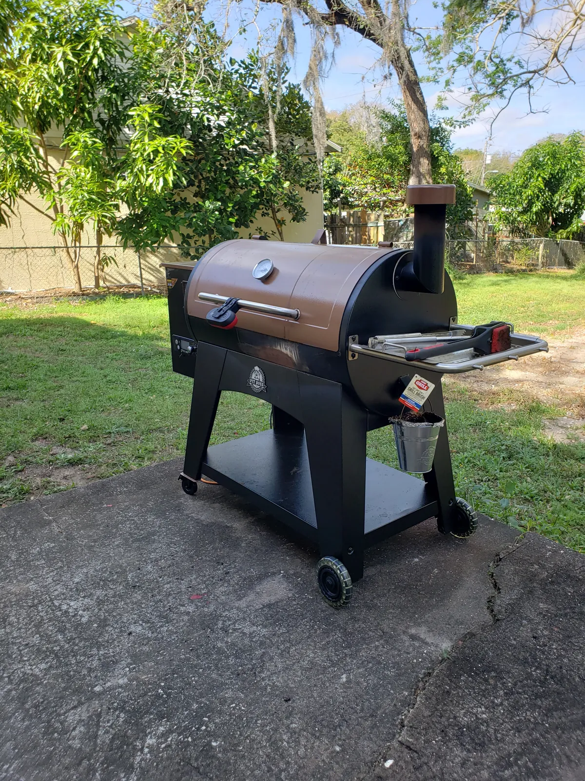 Pit Boss wood pellet grill assembled on a backyard patio slab in Florida