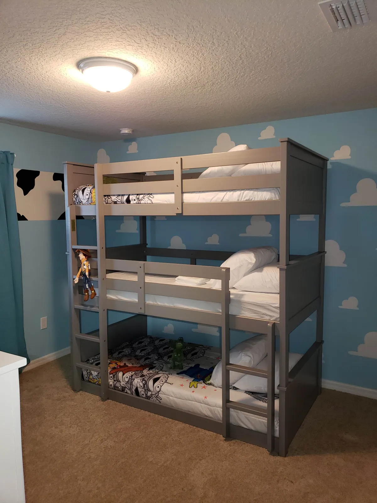 Grey house frame Montessori kids bed assembled in a Toy Story themed bedroom in Florida